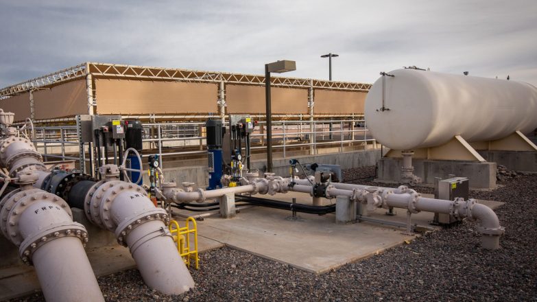 A water treatment plant with pipes and pipes in the background.