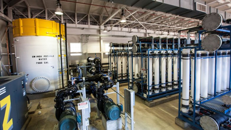 A water treatment plant with a large number of pipes.