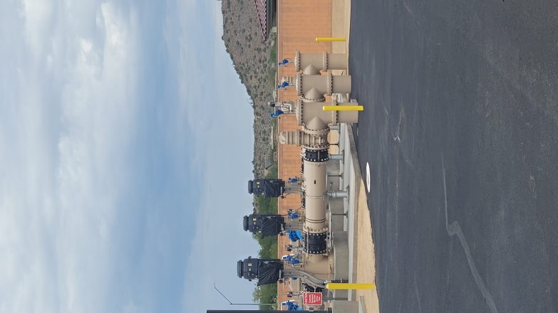 A view of a parking lot with parked cars.