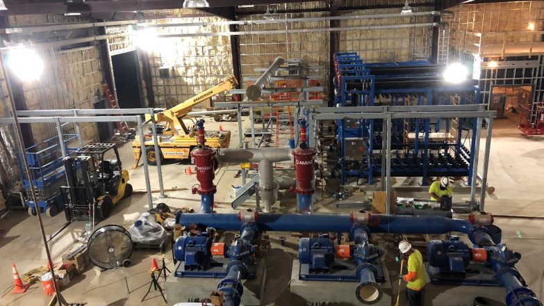 The construction of a water treatment plant in a large building.